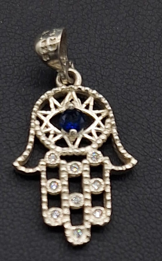 Sello de ley en el interior del dije plata ley 925 , mano de fatima con topacio azul
